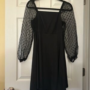 Black cocktail dress with puffy sheer sleeves